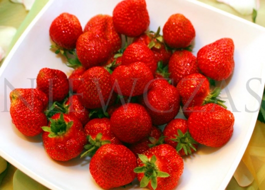 Honeoye red strawberries on a plate